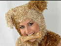 yiffy puppy girl in a furry costumes chews on her biscuit